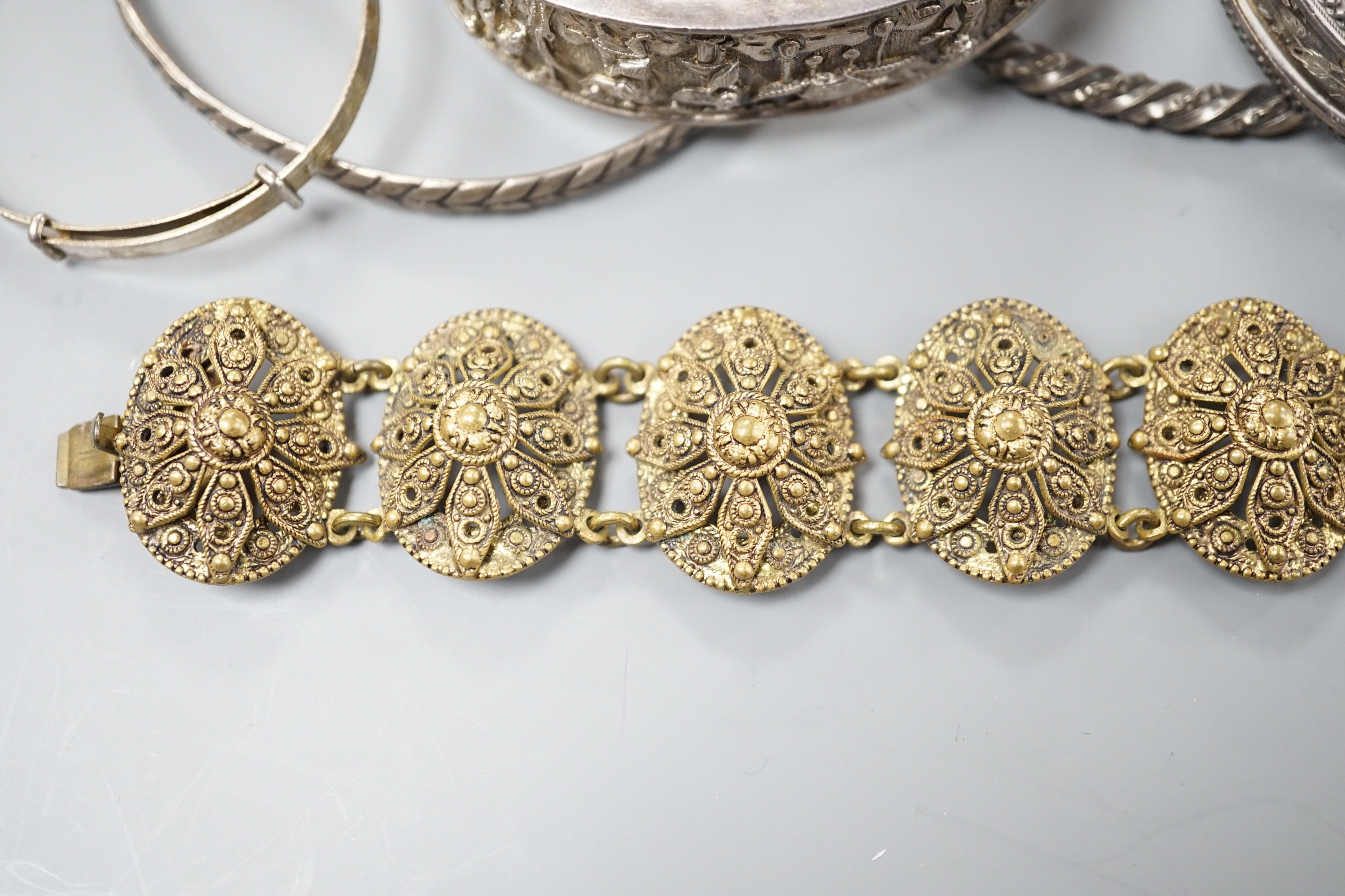 A Chinese white metal hinged bangle and five other items, including an engraved silver hinged bangle.